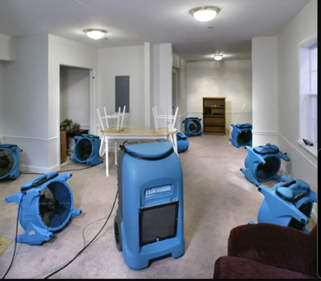 Air movers and dehumidifier setup for Water Damage Restoration in Richmond West